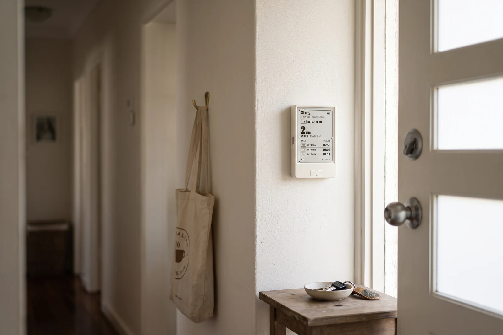 Get on board live departure display mounted beside a front door