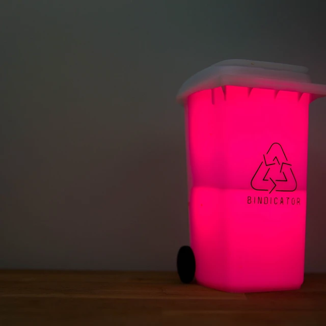 Bindicator glowing pink on a kitchen bench