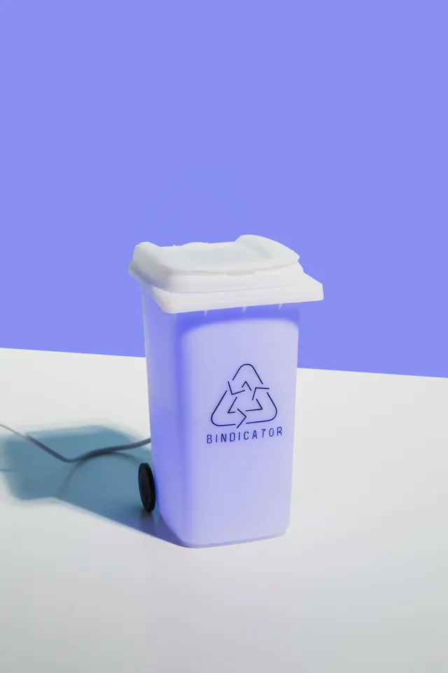 Bindicator lamp glowing in bin colours on a kitchen bench