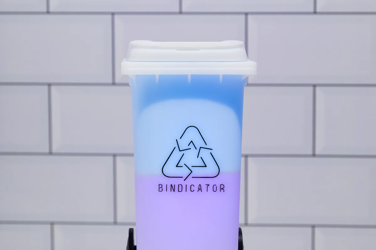 Bindicator lamp glowing on a kitchen shelf to show which bins go out tonight